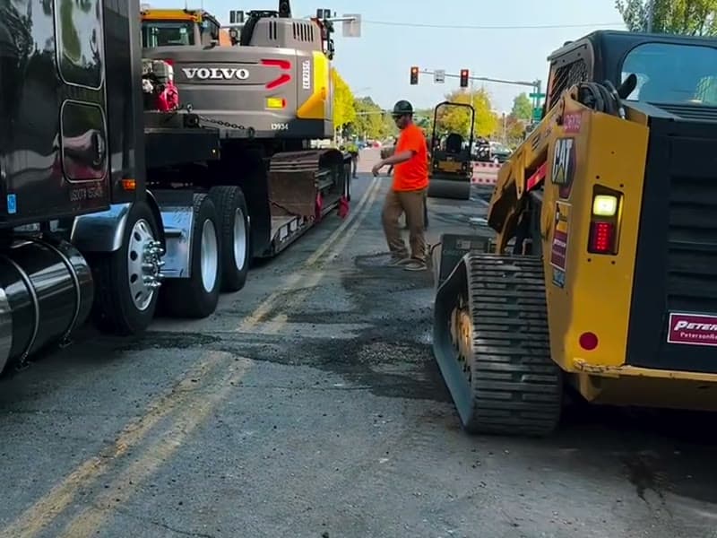 Civil West Construction branded excavator on site